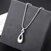 Collar con Botella de Perfume de Acero de Titanio Transfronterizo que no se decolora para Hombres, Colgante Cruzado de Tendencia Ins de Nicho, Accesorio Versátil de Alta Gama