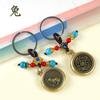 Nuevo llavero de metal de latón con forma de moneda colgante con cola de 12 signos del zodíaco que corren las decoraciones colgantes al por mayor