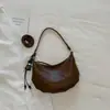 Bolsa estilosa de nicho Shuai Mi Jia para mulheres, novo modelo de verão 2026, bolsa simples tipo bolinho de ombro, bolsa de ombro e transversal