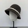 Sombrero de pescador tejido estilo japonés para mujer, cálido y adelgazante para la primavera y el verano, moderno sombrero tipo cubo con bloques de color