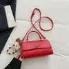 Bolsa feminina de nicho 2026 primavera nova moda bolsa de mão retrô simples elegante bolsa quadrada pequena bolsa de ombro transversal