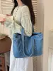 Bolso de mezclilla transfronterizo de gran capacidad para mujer, bolsa de compras ligera y versátil, bolso para estudiantes universitarias, conveniente para ir a clase, bolso de hombro ligero