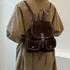 Novo estilo de mochila, adequado para o trajeto diário, bolsa de mão feminina, design retrô, 2026, versátil, pode ser carregada na transversal, no ombro ou como mochila, estilo coreano e japonês, simples, coleção de outono