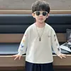 Camiseta de manga larga estampada para niños, primavera y otoño, estilo coreano, diseño de bloques de color, top casual para niños pequeños y niños, calidad de exportación