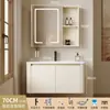 Tocador de baño engrosado y ahorrador de espacio con diseño en color crema, que cuenta con un lavabo redondeado, lavabo cerámico integrado y un lavabo de una sola pieza.
