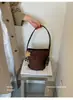 Bolso de mano de alta gama con acabado mate estilo vintage para mujer, nuevo bolso de hombro de moda 2026 para el día a día, bolso tote tipo cubo otoño/invierno