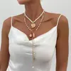 Joyería Elegante de Perlas Largas con Borla en Forma de Y Transfronteriza Europea y Americana Colgante Simple de Caracola y Cruz Collar Apilado