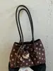 Bolso de mano simple de lunares estilo coreano Shuai Mi Jia para mujer, nuevo bolso tote moderno y elegante de nicho para el día a día 2026