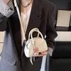 Bolsa pequena estilo ocidental de alta qualidade para mulheres, nova primavera de 2025, bolsa transversal versátil, elegante, simples e portátil, bolsa de boliche