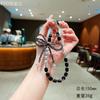 Cadena colgante para teléfono móvil con lazo de cristal, accesorio para colgar en la muñeca de mujer, funda corta para teléfono móvil, colgante, pulsera de cuentas para exteriores