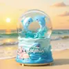 Cartón tarjeta cuero delfín de agua niño bola de cristal brillante caja de música escritorio adornos lindos waterpolo regalos al por mayor