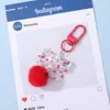 Chaveiro Pingente Bola de Pelúcia com Laço Colorido Estilo Ins Miçangas para Montagem DIY Acessório Versátil para Decoração de Bolsa de Trabalho