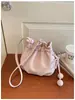 Bolsa de cordón de alta gama para mujer, bolso moderno y elegante, de un solo hombro, cruzada, bolso cubo casual versátil de moda