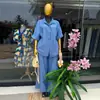 Moda Feminina Transfronteiriça Europeia e Americana Verão 2026 Novo Conjunto Elegante de Camisa de Manga Curta com Gola Reversível e Listras e Calças de Cintura Alta Wide Leg