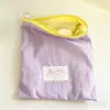 Bolsa de maquillaje portátil para viajes, bolsa delgada de color macarrón para guardar labiales y cosméticos, alto valor estético, bolsa simple con cremallera
