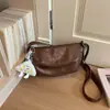 Bolsa Transversal Minimalista de Nicho Retro Formato Bolinho 2026 Nova Tendência Moda Bolsa de Ombro para Trabalho e Deslocamento
