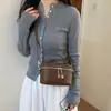 Bolso de mano de alta gama para mujer, bolso de hombro y cruzado simple y versátil, bolsa de maquillaje moderna y minimalista