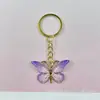 Chaveiro Borboleta Colorido Gradiente Popular Transfronteiriço Pingente Pequeno Criativo Estilo Europeu e Americano Acessório de Decoração para Mochila Estojo de Fone de Ouvido