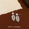 Pendientes de circonita con hojas de lujo y luz de verano para mujer, de dos piezas, de lujo y ligeros, de alta gama, con perlas, nuevos pendientes al por mayor.