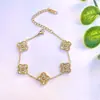 Conjunto de Quatro Peças de Pulseira, Colar, Brincos e Anel de Trevo de Quatro Folhas Dupla Face Transfronteiriço com Cravação de Diamantes, Design de Nicho em Ouro 18K Joias Leves