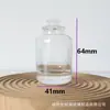 Atacado em estoque frasco de vidro cilíndrico para perfume de 50ml com tampa de bola de madeira, frasco vazio recarregável para cosméticos portátil de 30ml