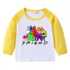Camiseta infantil de primavera y otoño 2023, nueva camiseta de manga larga con cuello redondo y dibujos animados, camiseta de algodón para bebés y niños.