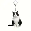 Llavero de gato esmoquin acrílico negro mate y blanco, diseño de doble cara, llavero para mascotas para mochila