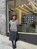 Falda de lana casual versátil de moda estilo coreano para mujer, de cintura alta, adelgazante, estampado de espiga, falda midi con abertura para otoño y primavera