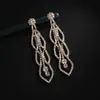 Serie de cadenas de garra de diamantes de imitación completamente nueva pendientes geométricos huecos de diamante pendientes de escenario para bodas al por mayor E755