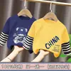 Camiseta de Manga Comprida para Meninos Estilo Primavera e Outono 2026 Novas Roupas de Outono para Crianças Camiseta Outono Algodão Puro Falso Duas Peças Listrada Camada Base