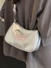 La popular bolsa baguette de este año 2024 verano bolso bandolera de nicho de alta gama para mujer estilo extranjero todo-partido bolso de hombro