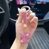 Chaveiro de Carro de Anjo com Corda de Argila Strass Inlaid Design Criativo de Personalidade Brilhante Decoração de Embalagem de Bolsa Pingente Venda por Atacado