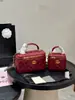 Nuevo modelo popular de comercio exterior: caja de maquillaje pequeña estilo Chanel con asa, bolsa para labiales, bolso acolchado con cadena, bolso de hombro, bolso cruzado