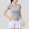 Camiseta de Yoga de Color Sólido con Cuello Redondo Ajustada de Manga Corta para Mujer Estilo Europeo y Americano Deportes Running al Aire Libre Tops de Fitness de Alta Elasticidad Venta al por Mayor
