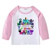 Camiseta infantil de primavera y otoño 2023, nueva camiseta de manga larga con cuello redondo y dibujos animados, camiseta de algodón para bebés y niños.
