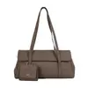 Bolso de axila de estilo minimalista de comercio exterior de nicho con patrón de lichi para mujer, versátil para principios de otoño, adecuado para el trabajo y los desplazamientos, bolso de mano de un solo hombro