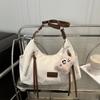 Bolso de mano de estilo coreano con diseño de nicho, exquisito, para mujer, primavera 2025, nuevo, moderno, de gran capacidad, para ir al trabajo.