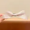 Presilhas de cabelo em formato de laço estilo coreano, projetadas para realçar o volume do cabelo, exalando um visual sofisticado e elegante. Esses grandes grampos de cabelo são perfeitos para adicionar volume na parte de trás da cabeça.
