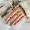 Versión coreana de anillo de flor fresca estilo pastoral dulce de bosque creativo anillo abierto de flor verde de pegamento de gota al por mayor