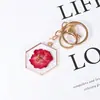 Ed nuevo llavero de flor seca espécimen de rosa metal de acero inoxidable hebilla de langosta accesorios de ropa fabricantes al por mayor
