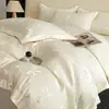 Juego de ropa de cama de jacquard lavado de Tencel de cuatro piezas para verano con lazo, seda de hielo y funda de edredón sedosa y suave para dormir cómodamente, juego de tres piezas para ventas transfronterizas