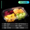 Caja rectangular de plástico transparente con tapa, compartimentada y sellada, para empaquetar ensalada de frutas.