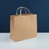 Bolsa de papel Kraft con remache spot, bolsa de compras 260g alto gramaje, empaque de regalo, bolso de mano de moda, bolsa para ropa, venta al por mayor