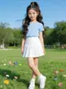 Falda Plisada Blanca para Niñas, Nuevo Estilo de Verano, Anti-Exposición, Falda Corta Estilo Universitario, Falda para Niños Medianos y Grandes, Falda de Uniforme Escolar para Niños