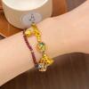Transmisión en vivo mismo estilo alta protección del color estilo antiguo color esmalte arena dorada familia de bestias doradas tres Jiyan pulsera media femenina venta al por mayor
