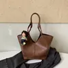 Bolso tipo cesta de mercado de moda estilo coreano 2025 nuevo versátil con patrón de lichi bolso de mano de alta gama de un solo hombro cruzado