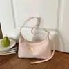 Bolso de axila texturizado transfronterizo para mujer, nuevo modelo 2026, bolso simple de media luna, bolso versátil para hombro y cruzado