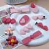 Clips Mixtos al por Mayor de un Dólar de Moda Populares Pasadores Infantiles de Dibujos Animados Lindos Accesorios para el Cabello de Puesto de Exposición del Mercado Nocturno