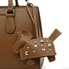 Regalos Creativos de Venta Caliente Transfronterizos, Colgante Tejido de Metal de Cuero de PU, Ropa de Moda Retro, Accesorios para Equipaje, Llavero