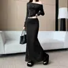 Traje de una sola manga estilo chica picante transfronterizo francés 2026 otoño nueva moda top corto falda de sirena de cintura alta adelgazante